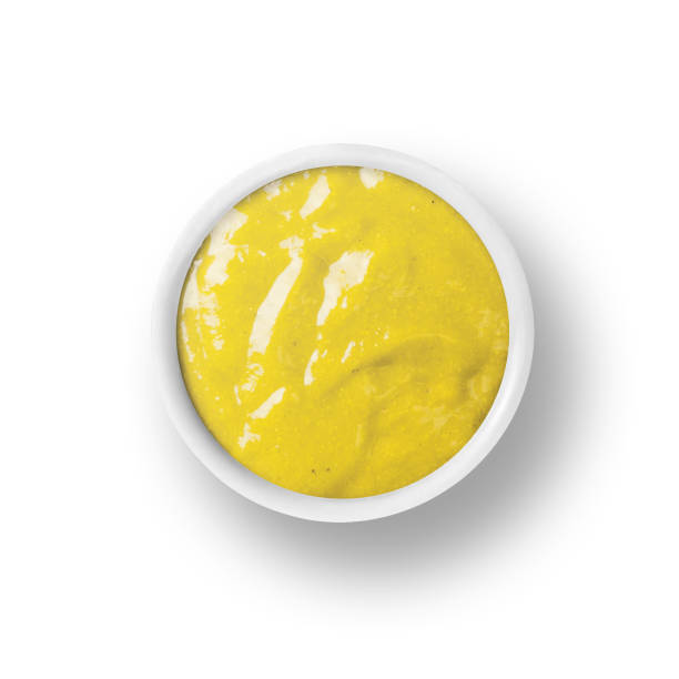 istock Mustard sauce in cup isolated on white 969655864