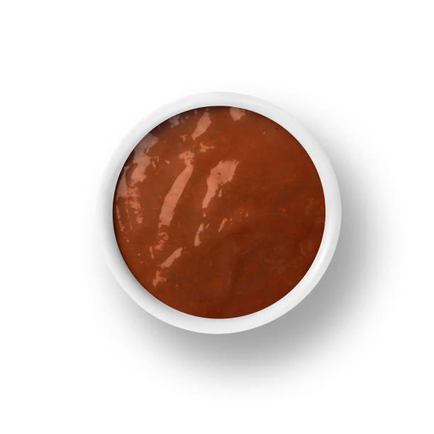 istock Barbecue sauce in cup isolated on white 969655978