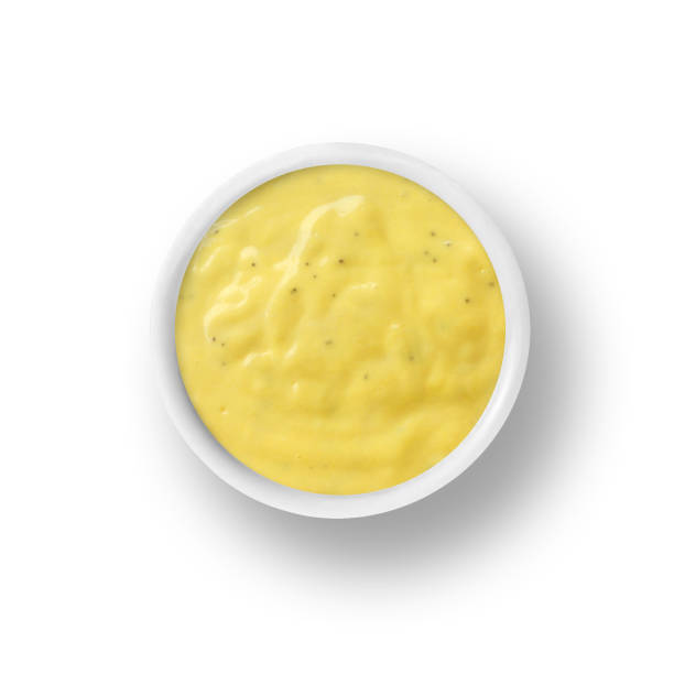 istock Honey Mustard dressing in cup isolated on white 969657626