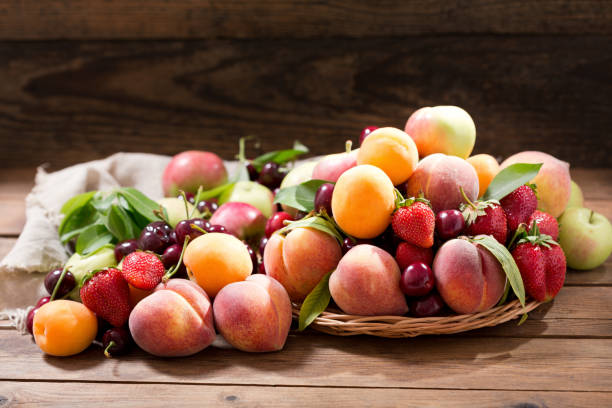 istock fresh fruits on wooden table 969660348