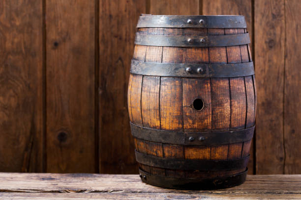 istock wooden barrel on rustic wooden background 969660608
