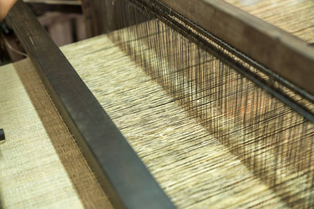 Weaving silk in traditional way in Vietnam. Vietnamese silk processing.