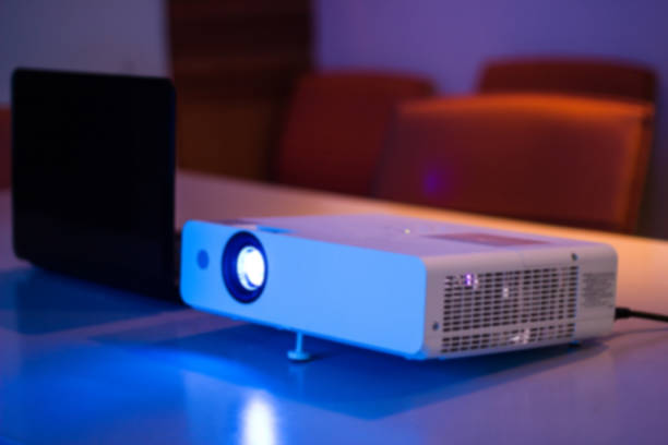 istock projector connected to Laptop with file folder on the table in a meeting room 969667412