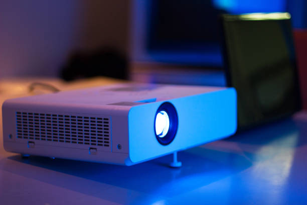istock projector connected to Laptop with file folder on the table in a meeting room 969667560