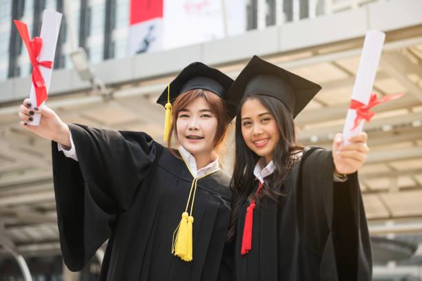 istock Graduate women students in Commencement day 969667886