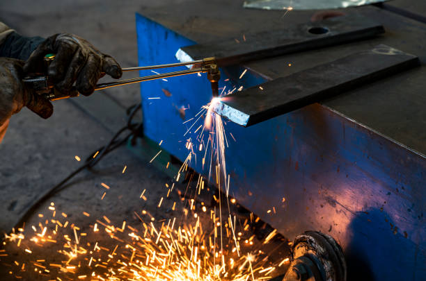 istock Craftsman repairman is working with welding machine torch 969670182