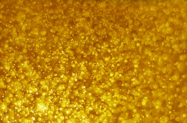 istock abstract yellow gold bokeh glitter sparkle background. 969670542