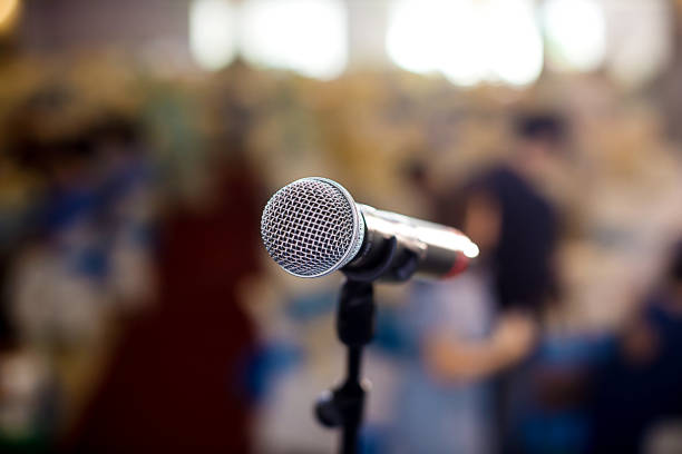 istock Microphone in concert hall or conference room soft and blur style for background. 969671346