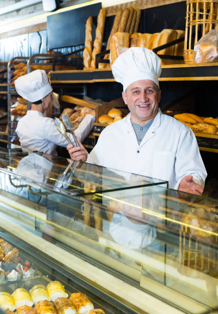 istock two bakers at the counter at bakery 969677348