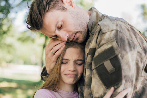 istock Soldier saying goodbye to his daughter 969681056