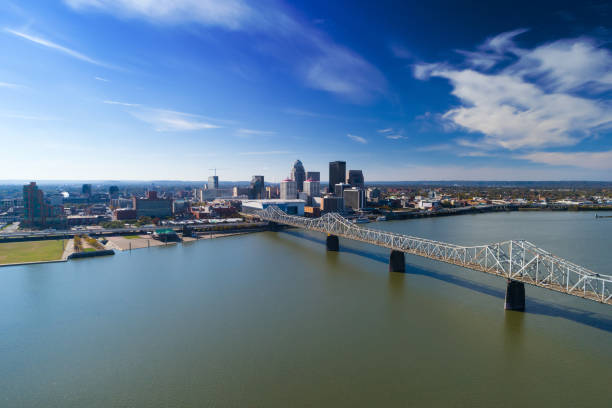Lousville Skyline Aerial With Bridge and River Louisville skyline aerial view with the Clark Memorial Bridge and the Ohio River in the foreground. ohio river photos stock pictures, royalty-free photos & images