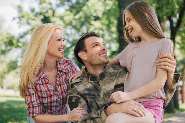 istock Soldier hugging with his family 969684030