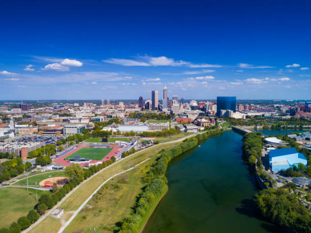 Indianapolis Aerial View With White River Indianapolis aerial view with Downtown Indianapolis and a blue sky with clouds in the background, and White River and Indiana University - Purdue University Indianapolis(left) and Indianapolis Zoo (right) in the foreground. indianapolis photos stock pictures, royalty-free photos & images