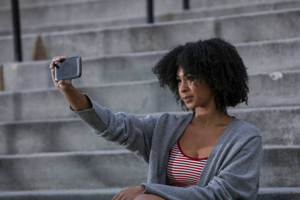 istock Woman in city taking selfie 969687886