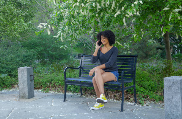 istock Woman in park talking on phone 969688208