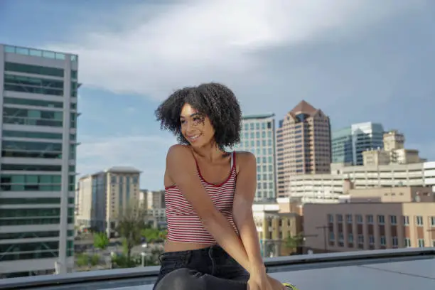 Young woman portrait with Salt Lake City skyline in background