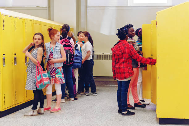 istock School kids at elementary school lockers 969688650