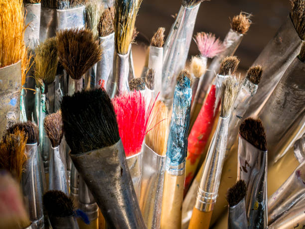 istock Closeup old used artist paint brush 969689394