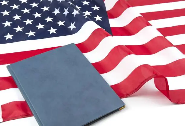 American flag with US constitution or holy bible.