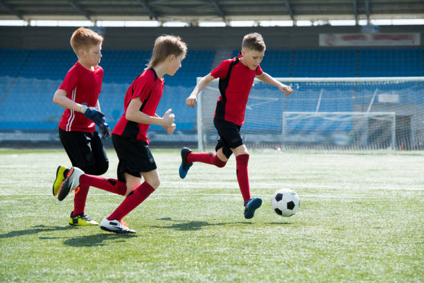 istock Kids Playing Football 969704868