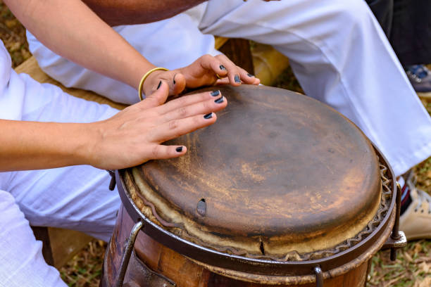 istock Young woman hands playing drum 969707216