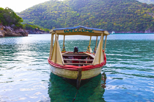 Haitian Fishing Boat: An old fishing boat near Labadee Haitian Fishing Boat: An old fishing boat near Labadee, Haiti labadee stock pictures, royalty-free photos & images