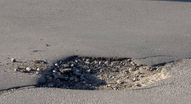 istock there are many potholes on the roadway close up 969719776