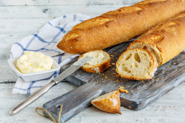istock Sliced artisanal baguette on the cutting board. 969723194
