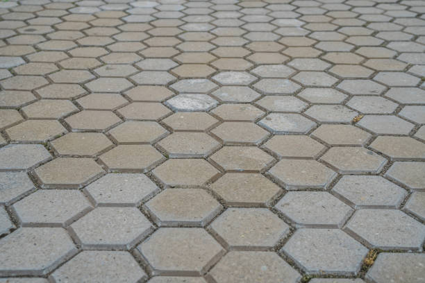 Stone pavement texture. Abstract background of old cobblestone pavement.