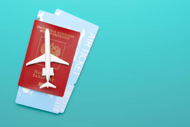 istock Toy plane on passport and tickets 969753178