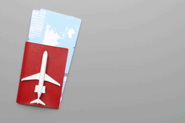 istock Toy plane on passport and tickets 969753182