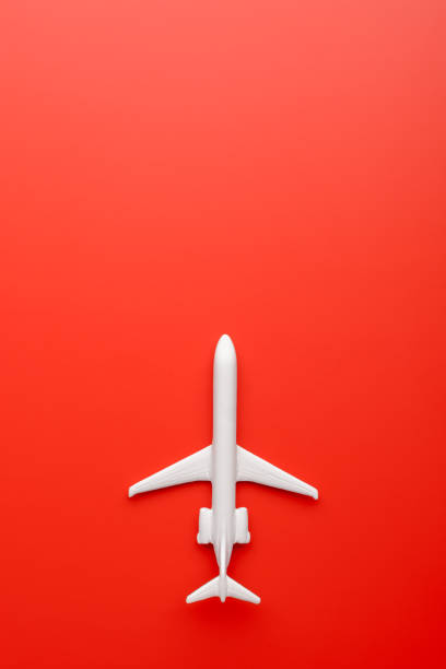 istock Toy plane on red background 969753194