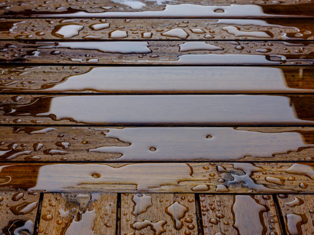 istock Wooden planks bathed in the rain 969755500