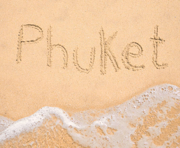 istock The word Phuket written in the sand on beach 969806318