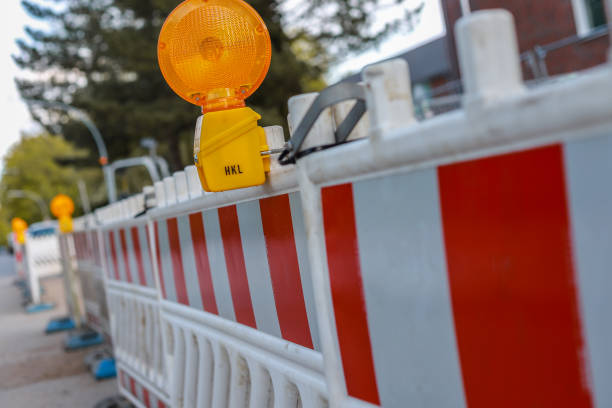 istock red and white barricades with two warning lights 969806574