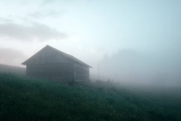 istock Alone house on foggy meadow 969812636