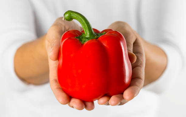 istock Woman with red bell pepper 969826740