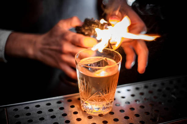 istock Bartender fired the orange zest for adding it to the fresh alcoholic drink 969827058