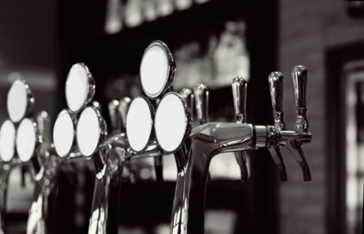 Unique beer taps on a lounge counter