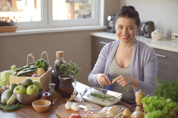 istock woman cooking in the kitchen( with dough) 969827268