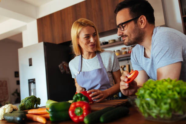istock Young couple in love in the kitchen 969834116