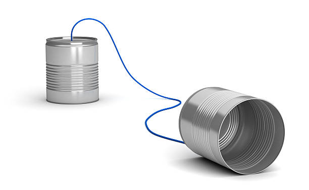 istock A tin can telephone on a white background 96983440