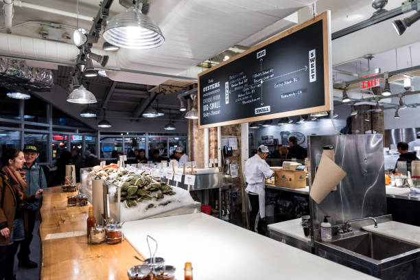 market food lobster place shop interior inside in downtown lower chelsea neighborhood district manhattan nyc, chef preparing food, oyster menu - indoors luxury restaurant store imagens e fotografias de stock