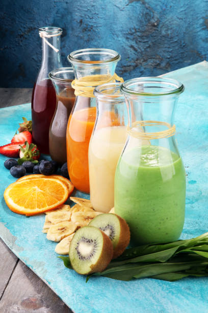 istock Selection of colorful smoothies on rustic background 969840200