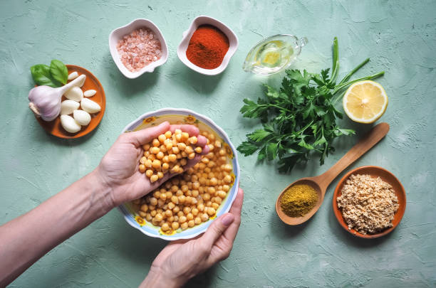 istock Ingredients for traditional hummus on the kitchen table. Top view. 969841184