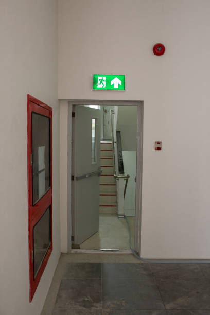 istock Green emergency exit sign showing the way to escape. 969841228