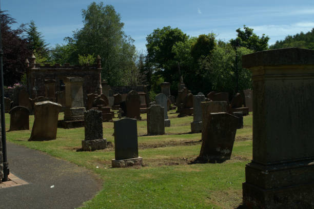 Cemetery at Sorn kirkyard, Ayrshire, Scotland Image of gravestones in the kirkyard at Sorn, Ayrshire, Scotland kirkyard stock pictures, royalty-free photos & images