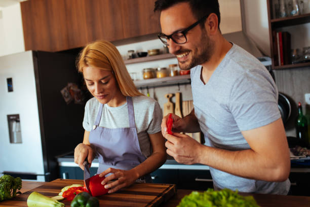 istock Young couple in love in the kitchen 969841378