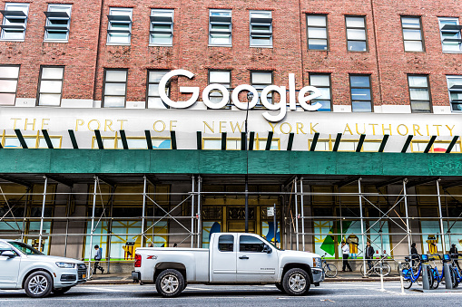 New York City, USA - October 30, 2017: Google company office green sign in downtown lower Chelsea neighborhood district Manhattan NYC, scaffold construction