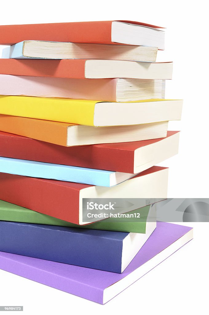 Untidy pila di libri colorati Libro in brossura - Foto stock royalty-free di Bianco
